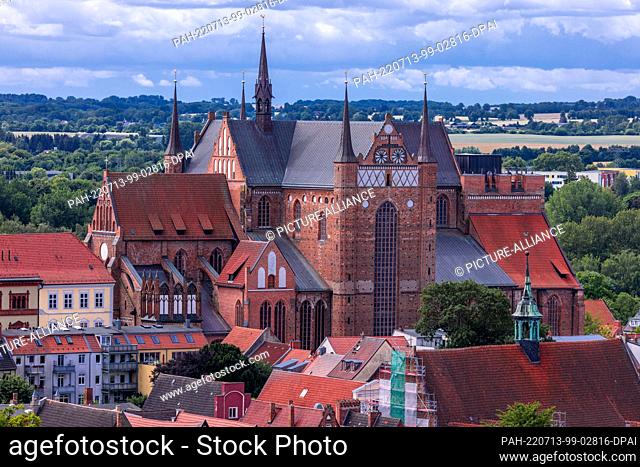 06 July 2022, Mecklenburg-Western Pomerania, Wismar: St. George's Church, destroyed during the war and rebuilt after reunification, in the Old Town of Wismar