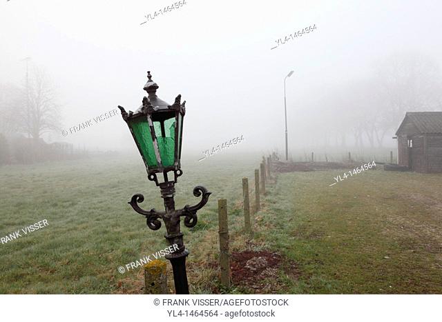 Lamp post in farm landscape. Netherlands