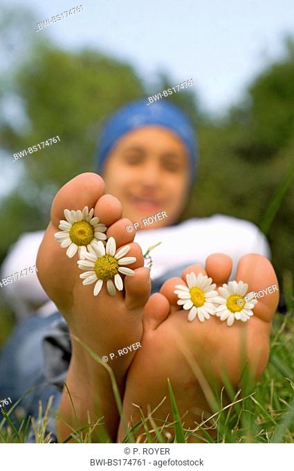 feet with flowers between the toes