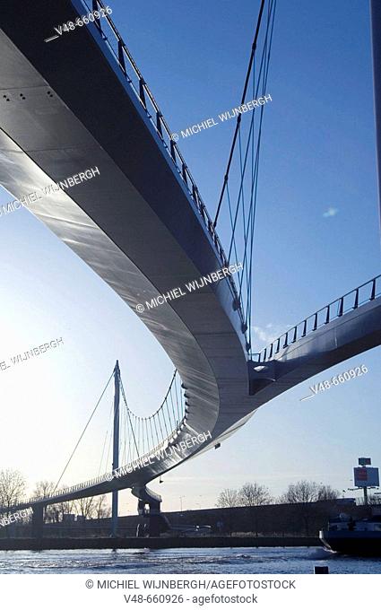 Modern bridge for cyclist and pedestrians to a new built part of Amsterdam, Ijburg. Netherlands, (January 2007)