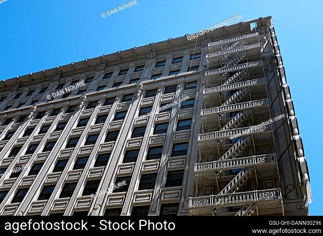 Cast iron fire escape on corner of building, Low Angle View, Los Angeles, California, USA