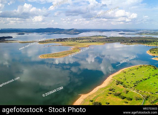 Lake reservoir water reflection drone aerial view of Alqueva Dam landscape and in Alentejo, Portugal