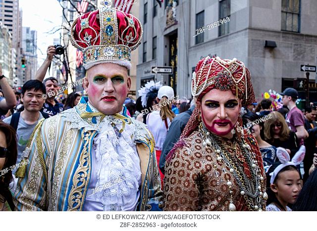 New York, NY - April 16, 2017. Two men in exotic bejeweled headpieces and costumes at New York's annual Easter Bonnet Parade and Festival on Fifth Avenue