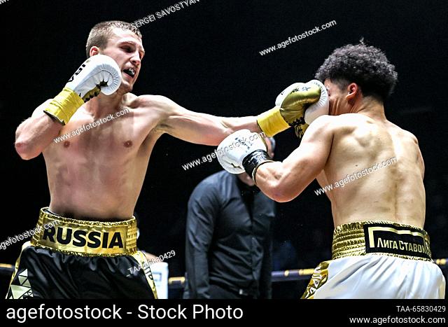 RUSSIA, MOSCOW - DECEMBER 17, 2023: Boxers Vsevolod Shumkov (L) of Russia and Abel Mendoza of the United States fight in a boxing bout as part of the IBA...