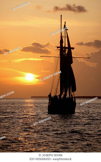 The Sea Wolf ship silhouetted at sunset on a cruise in Key West, Florida