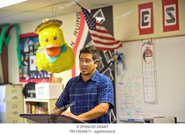 A California middle school Spanish teacher in a classroom decorated with a pinata