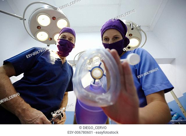 Teamwork with nurse and surgeon performing surgery in hospital operation room