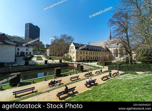 Ixelles, Brussels - Belgium: Panoramic ultra wide view over the park and site of the La Cambre Abbey with people sitting around the water pond