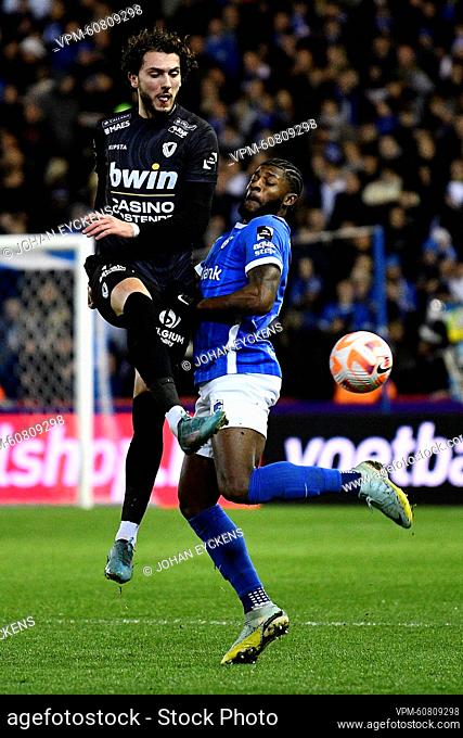 Oostende's Fraser Hornby and Genk's Mark McKenzie fight for the ball during a soccer match between KRC Genk and KV Oostende, Saturday 25 February 2023 in Genk