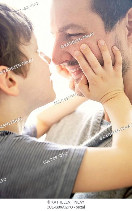 Boy showing affection to father