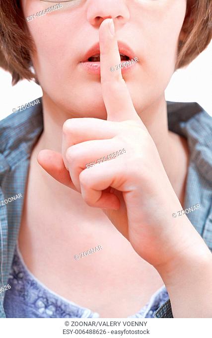 front view of finger near lips - hand gesture