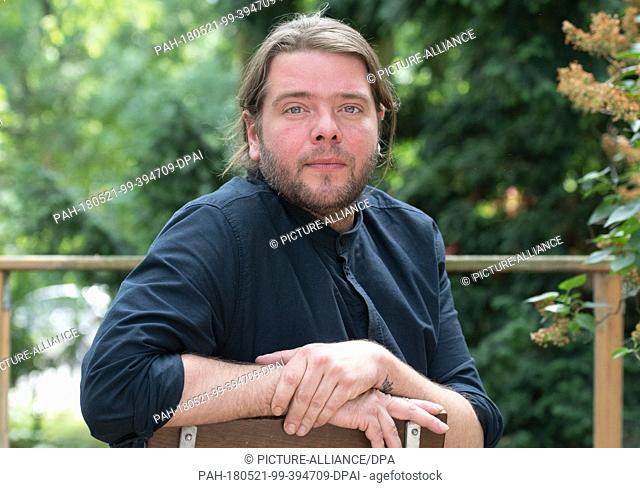 21 May 2018, Germany, Berlin: Belgian theatre and film actor Benny Claessens looking into the camera before the Berliner Festspiele building