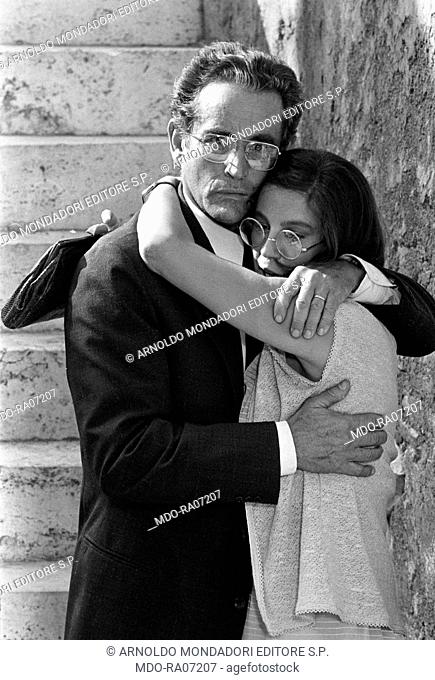 Italian actor Vittorio Gassman and Italian actress Stefania Sandrelli hugging each other in the film The Terrace. 1980