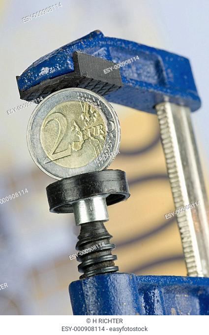 Euro coin in a clamp