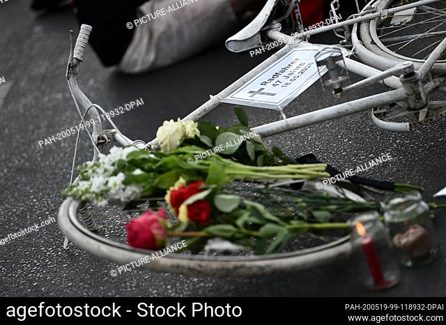19 May 2020, Berlin: A so-called white ghost wheel lies on Landsberger Allee at a vigil on the street. There a cyclist was run over by a truck on Monday and...