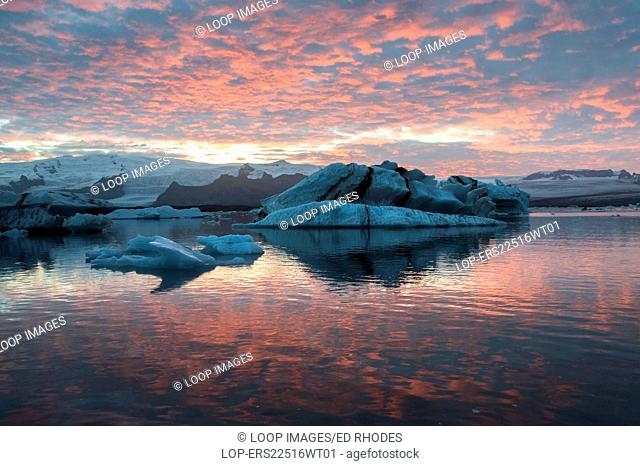 A dramatic red sunset at Jokulsarlon Iceberg Lagoon