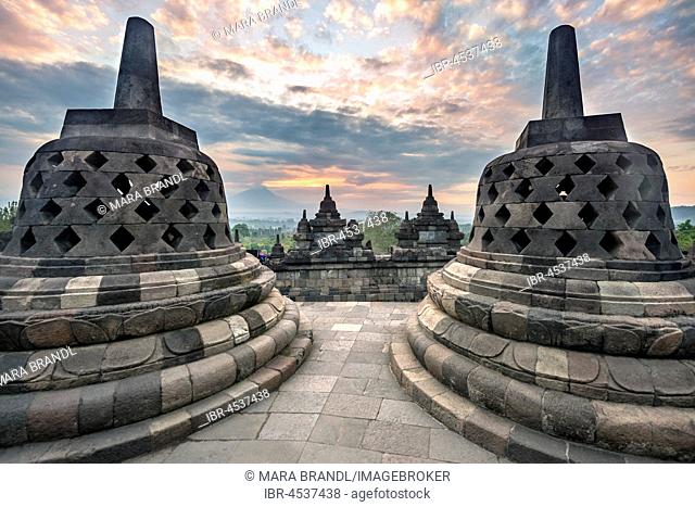 Temple complex Borobudur at sunrise, Stupas, cloudy sky, Borobudur, Yogyakarta, Java, Indonesia