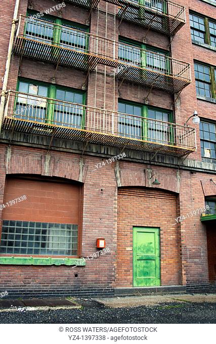 A brick building with a bright green door in Spokane, Washington, USA