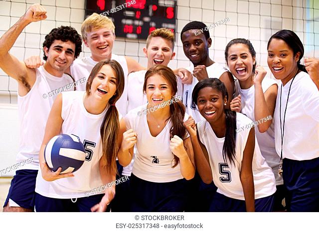 Portrait Of High School Volleyball Team Members With Coach