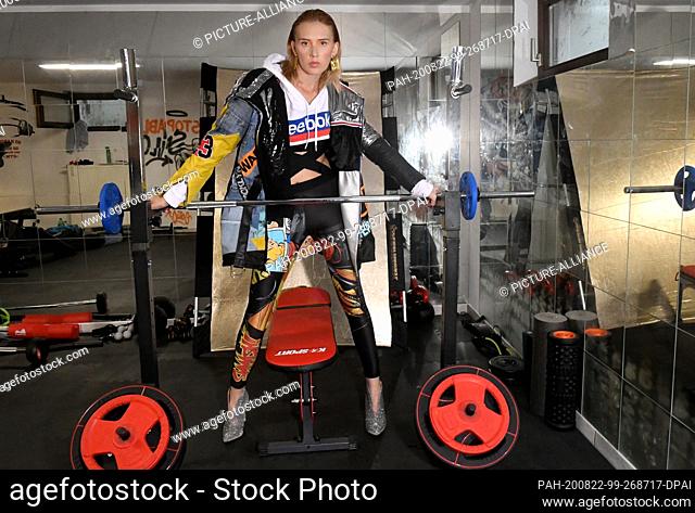 22 August 2020, Bavaria, Hallbergmoos: Model Anastasia poses at a fashion shoot of the designer Pia Bolte in a home gym. Photo: Felix Hörhager/dpa