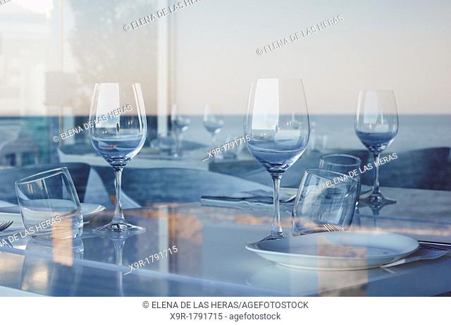 Reflected sea on a restaurant's window  Denia  Alicante  Spain