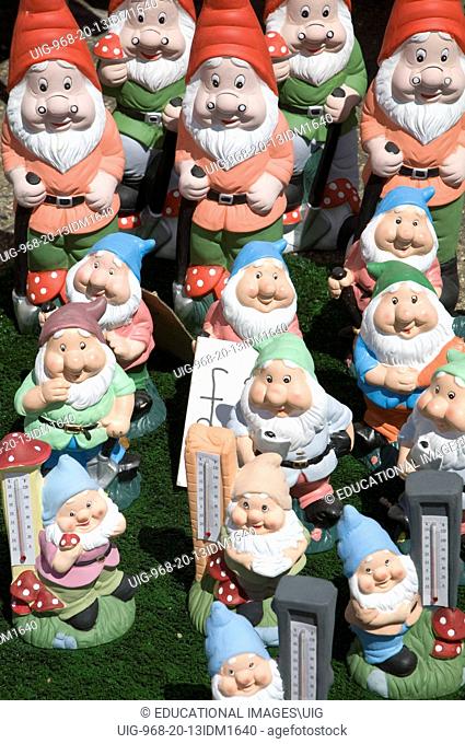 Colourful garden gnomes lined up for sale, UK