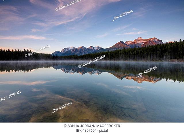 The Bow Range reflected in Herbert Lake at dawn, Banff National Park, Canadian Rockies, Alberta Province, Canada