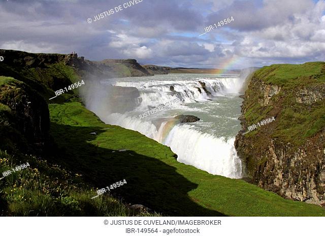 Gullfoss-Waterfall at the Hvita-River near by the Langjoekull-Glacier in Iceland with rainbow in the evening light Golden Waterfall Iceland
