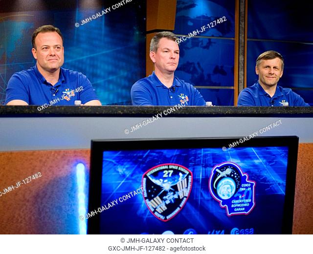 Russian cosmonaut Andrey Borisenko (right), Expedition 27 flight engineer and Expedition 28 commander; Russian cosmonaut Alexander Samokutyaev (center) and NASA...