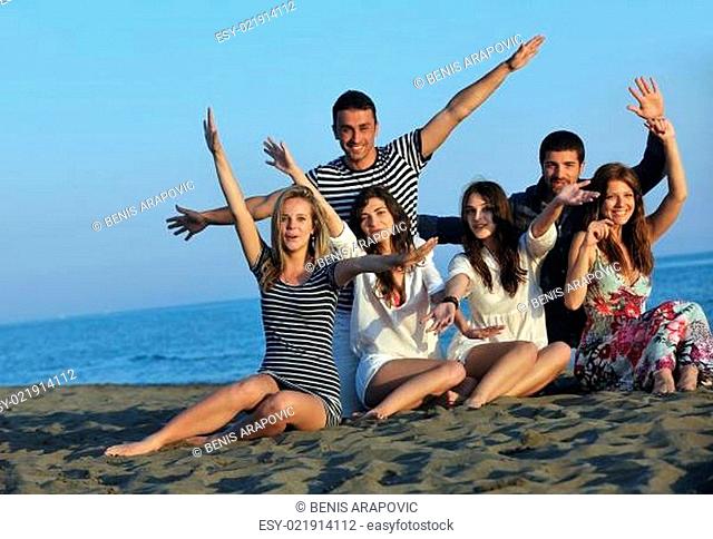 happy young people group have fun on beach