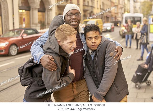 young men in city, in Munich, Germany