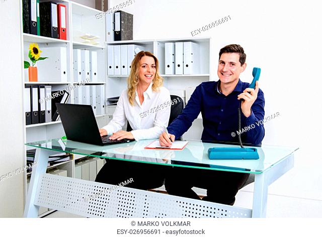 young businessman and businesswoman working together in the office