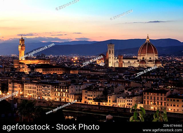Top view of Florence city with old and historical buildings, on cloudy sunrise or sunset sky background