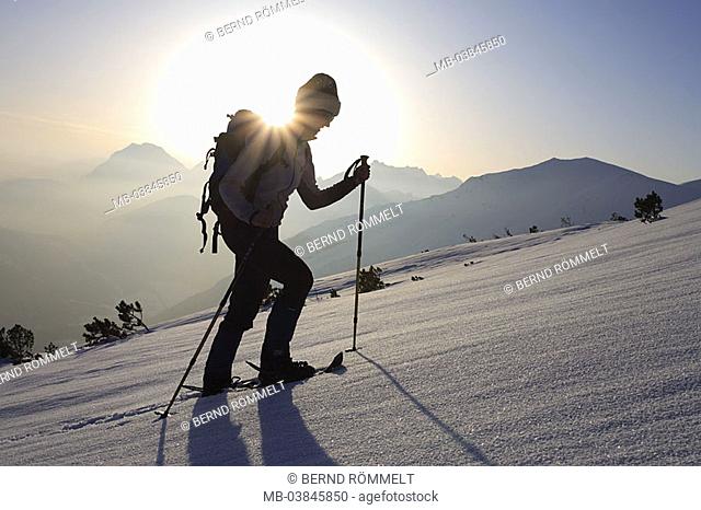 Austria, Tyrol, Scharnitz, Pleisen, woman, snowshoe-hike, upward, back light, winters, mountains, Pleisenspitze, snow-surface, hillside, snow, sportswoman