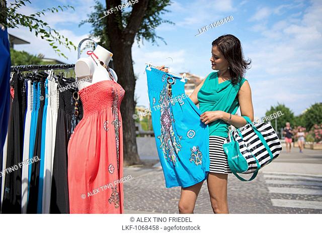 Woman with shopping bags, Bibione, Venice, Veneto, Italy