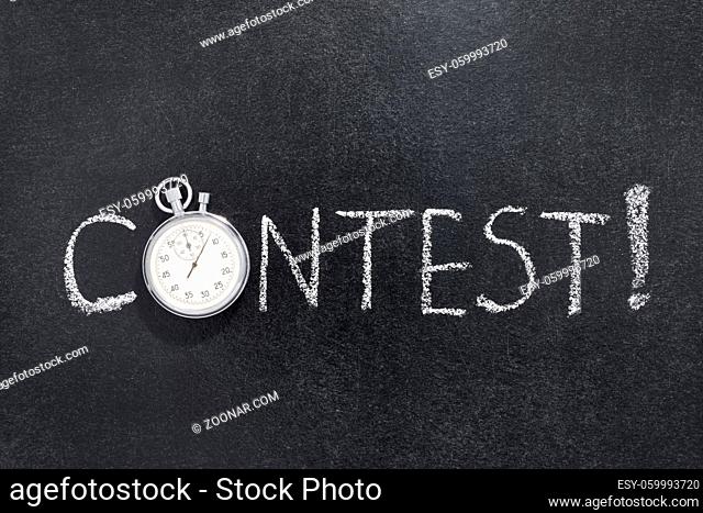 contest exclamation handwritten on chalkboard with vintage precise stopwatch used instead of O