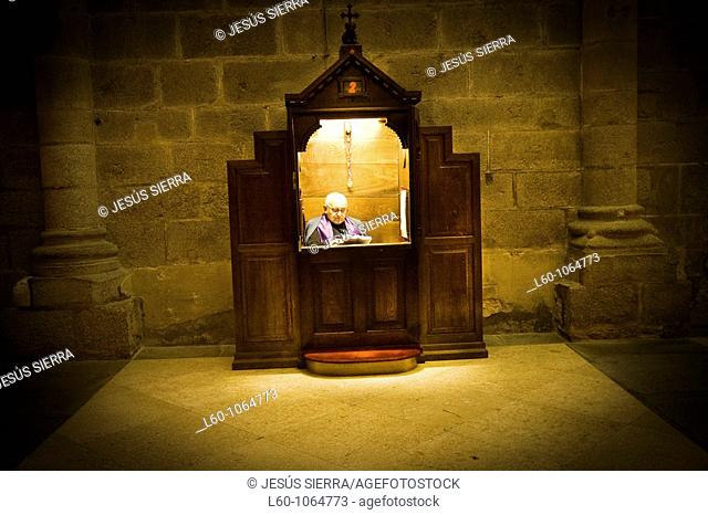 Priest in confessional  Cathedral Santiago, Santiago de Compostela, Galicia, Spain