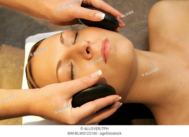 woman relaxing having a hot stone, lastone therapy
