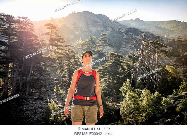 Female hiker looking up, Albertacce, Haute-Corse, Corsica, France