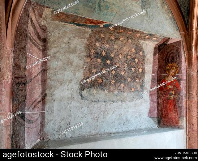 Basel, BL / Switzerland - 8 July 2020: close up view of a gothic wall mural inside the St. Peter's Church in Basel