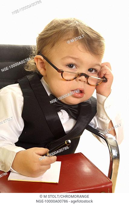 little boy with attaché case and cell phone