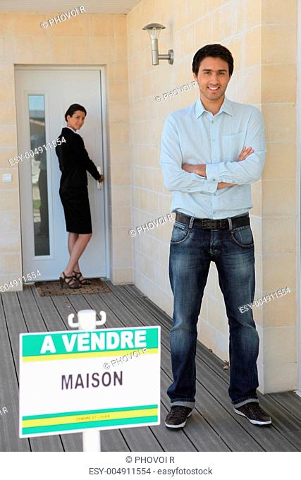 Estate agent showing man around property