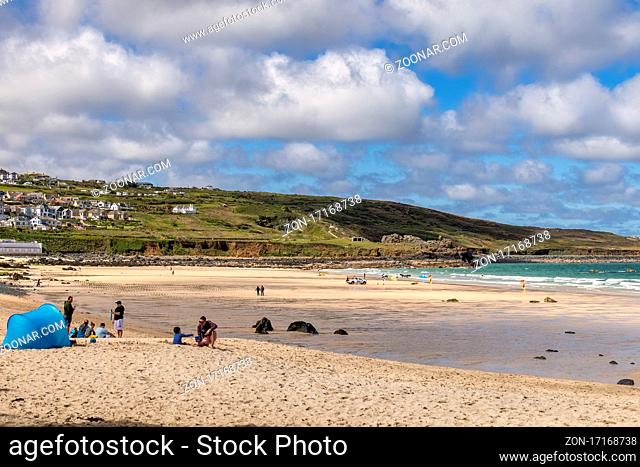 ST IVES, CORNWALL, UK - MAY 13 : View of Porthmeor beach at St Ives, Cornwall on May 13, 2021. Unidentified people