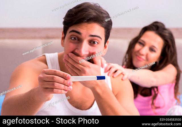 The young family with pregnancy test results
