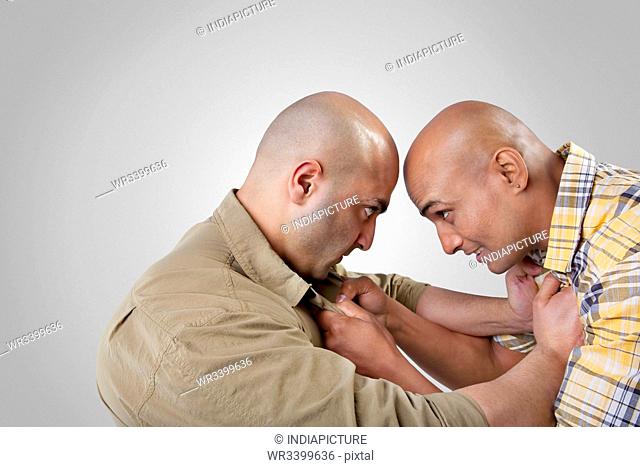 Bald men fighting