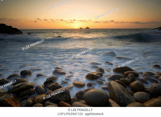 England, Cornwall, Porth Nanven. High tide during sunset at Porth Nanven bay on the Cornish coast