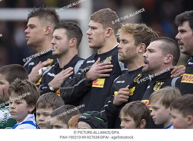 09 February 2019, Belgium, Bruessel: Rugby: EM, Division 1A, Matchday 1: Belgium-Germany. While playing the national anthem from the left: Sebastian Ferreira...