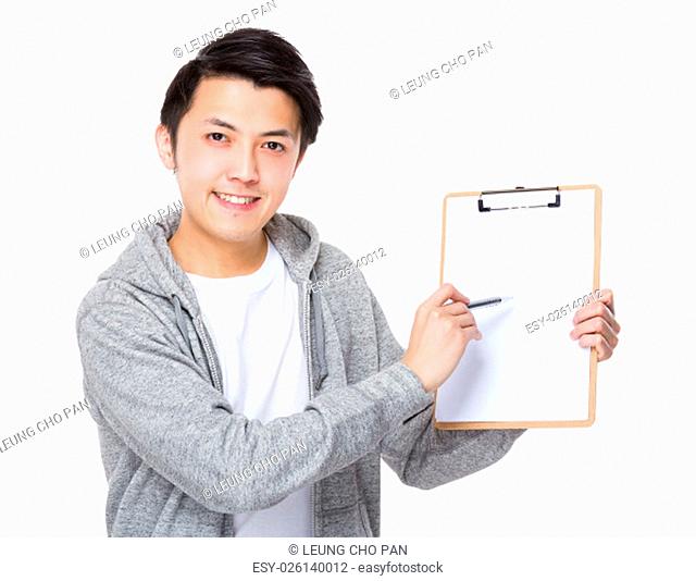 Asian man with pen point to clipboard