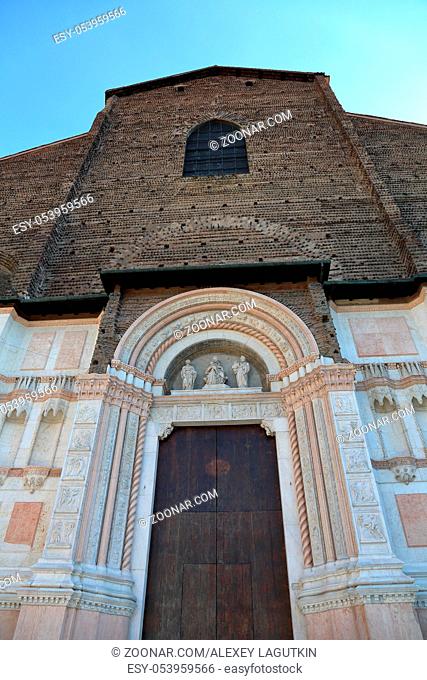 BOLOGNA, ITALY - JULY 20, 2018: Facade of the Basilica of San Petronio in Piazza Maggiore. The sixth largest church in Europe
