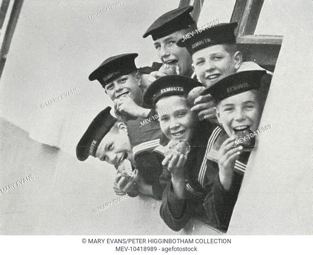 Boys eating buns on the Training Ship Exmouth, operated from 1876 by the Metropolitan Asylums Board on the Thames off Grays, Essex